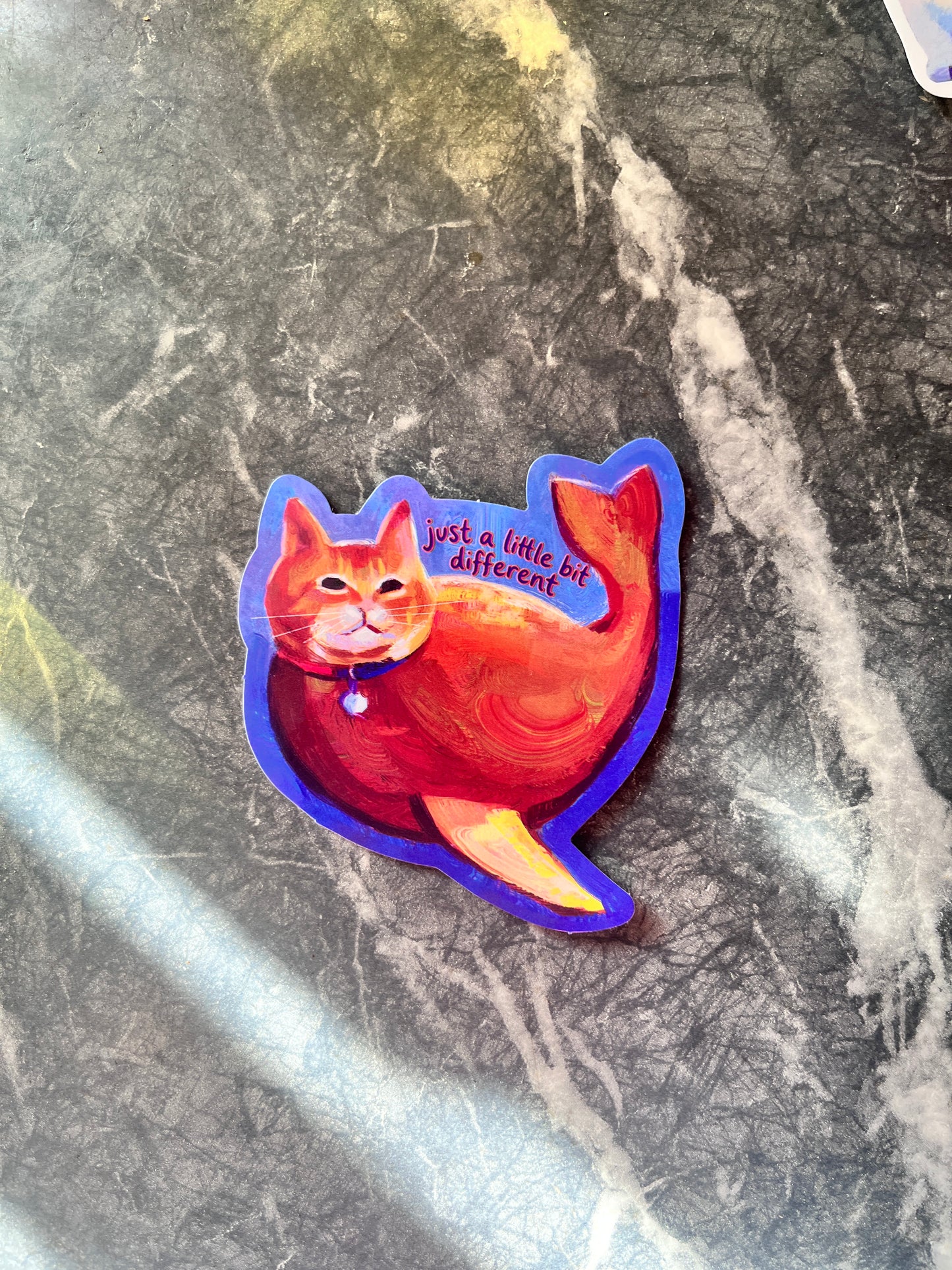 Just a Little Different orange cat sticker